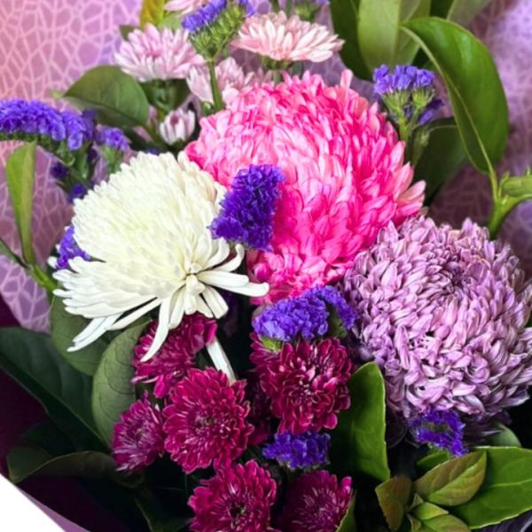 Beautiful flower arrangement featuring mums and disbuds in a decorative box