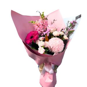 Stunning floral arrangement featuring majestic mums, dreamy delphinium, vibrant gerbera, and popcorn hydrangea with spray roses