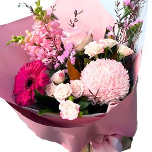 Stunning floral arrangement featuring majestic mums, dreamy delphinium, vibrant gerbera, and popcorn hydrangea with spray roses
