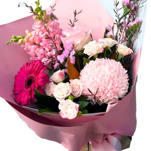 Stunning floral arrangement featuring majestic mums, dreamy delphinium, vibrant gerbera, and popcorn hydrangea with spray roses