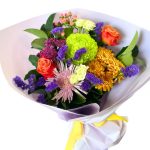 Beautiful bouquet of mums, roses, gerbera daisies, and misty