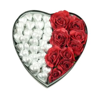 A red rose and heart-shaped chocolates in a box, symbolising love and romance.